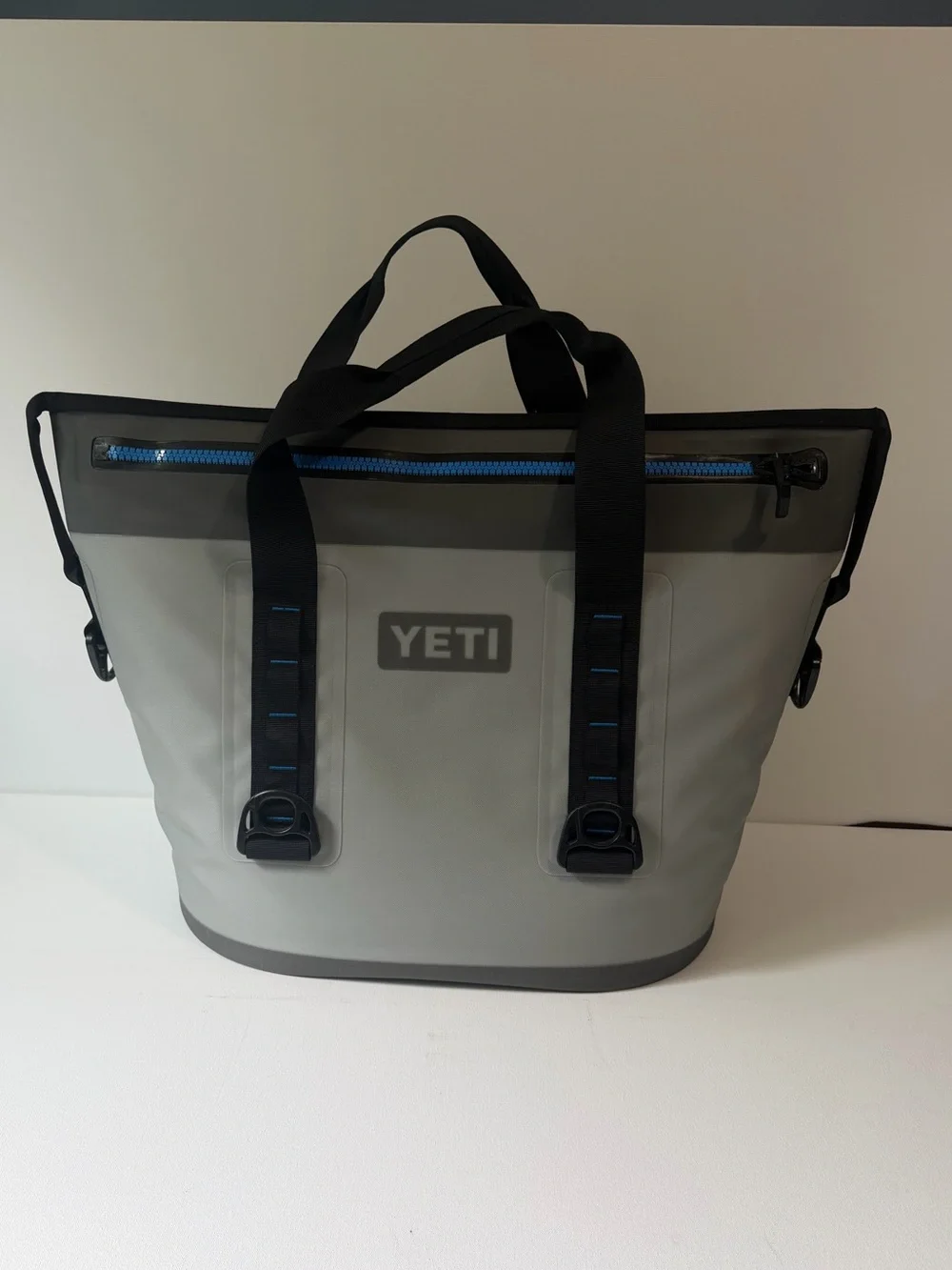 Yeti Hopper Two 30 Tote in Gray with Black Handles and Blue Zipper MSRP: $350